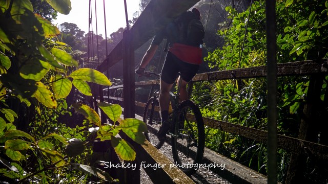 crossing swingbridge by bike Heaphy track
